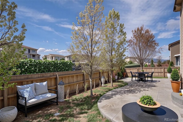 6370 Twilight Ave, Firestone, CO 80504 - fenced backyard with a patio area and outdoor dining area