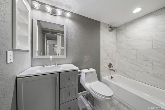 1970 S Xanadu Way Unit 101, Aurora, CO 80014 - bathroom featuring a textured wall, vanity, and shower / bath combination