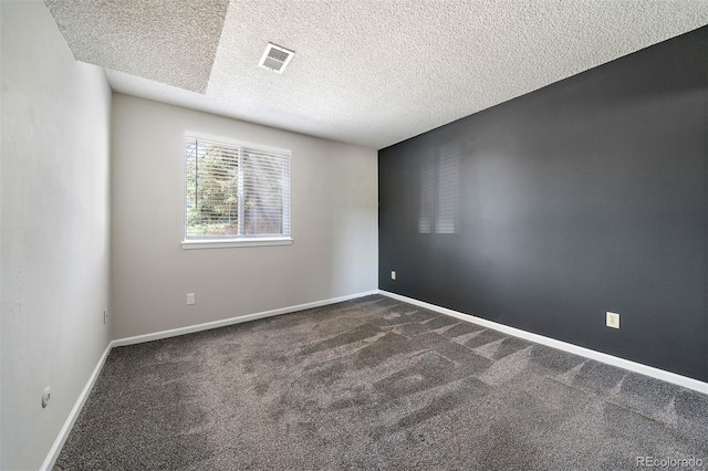 1970 S Xanadu Way Unit 101, Aurora, CO 80014 - unfurnished room with dark colored carpet and a textured ceiling