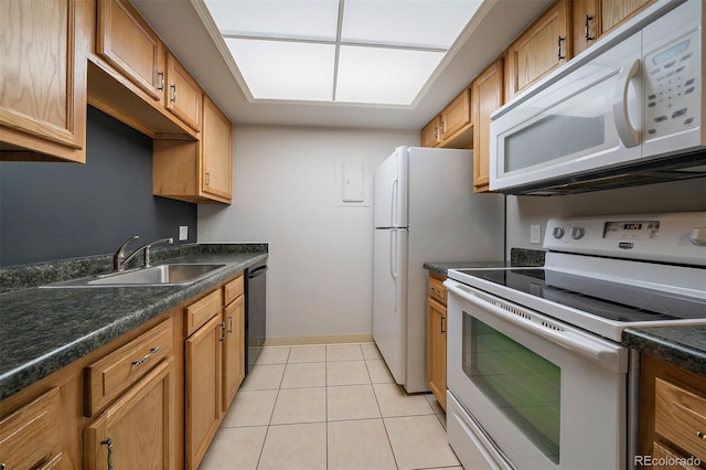 1970 S Xanadu Way Unit 101, Aurora, CO 80014 - kitchen with white appliances, dark countertops, light tile patterned floors, and brown cabinets