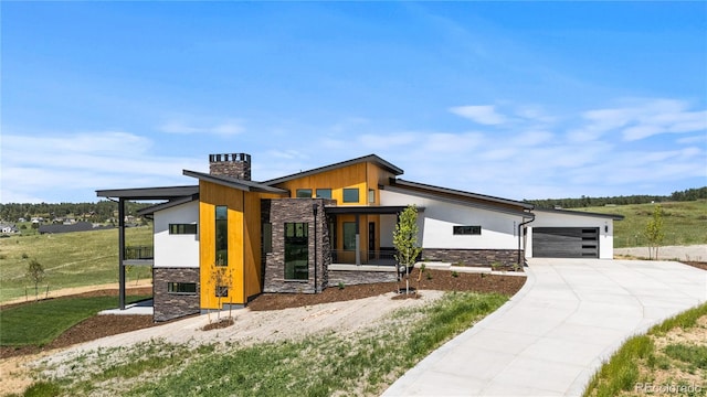 11115 Evening Hunt Rd, Franktown, CO 80116 - modern home featuring stone siding, a chimney, driveway, and stucco siding