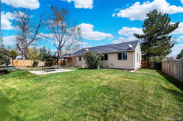 1765 S Endicott St, Lakewood, CO 80232 - rear view of house with a patio area