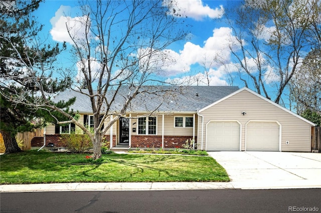 1765 S Endicott St, Lakewood, CO 80232 - view of front of property with an attached garage, brick siding, driveway, and roof with shingles