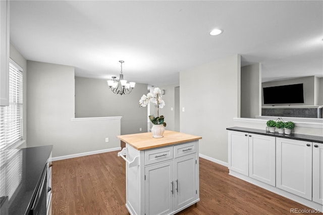 1765 S Endicott St, Lakewood, CO 80232 - kitchen with wood counters, baseboards, a chandelier, dark wood-style flooring, and recessed lighting