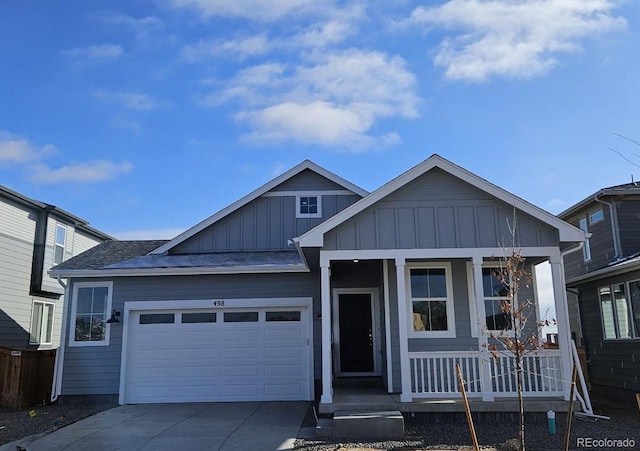 view of front of home featuring a porch and a garage