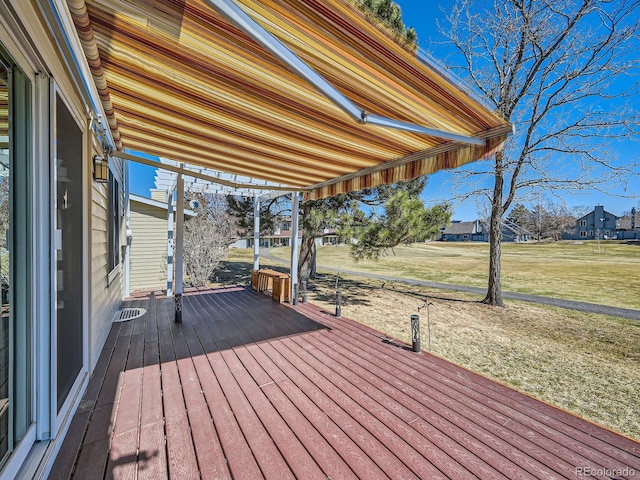 wooden terrace with a yard