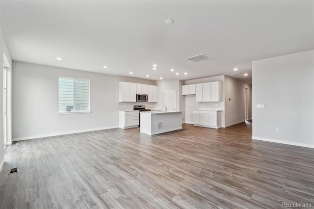 unfurnished living room with light wood-type flooring