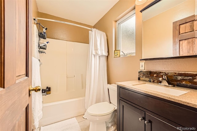 bathroom featuring toilet, vanity, tile patterned flooring, and shower / bath combo
