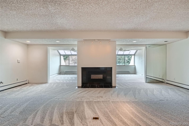 unfurnished living room with a baseboard radiator, carpet, a textured ceiling, and ceiling fan