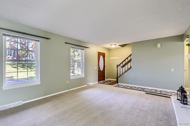 interior space featuring a textured ceiling