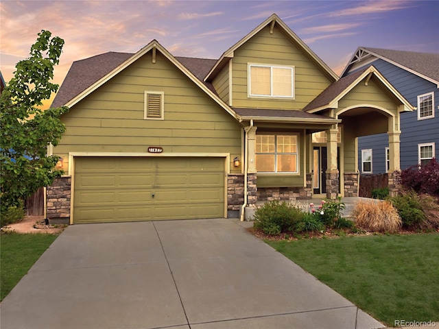 11649 E 111th Ave, Commerce City, CO 80640 - craftsman-style home featuring stone siding, driveway, a front lawn, and roof with shingles