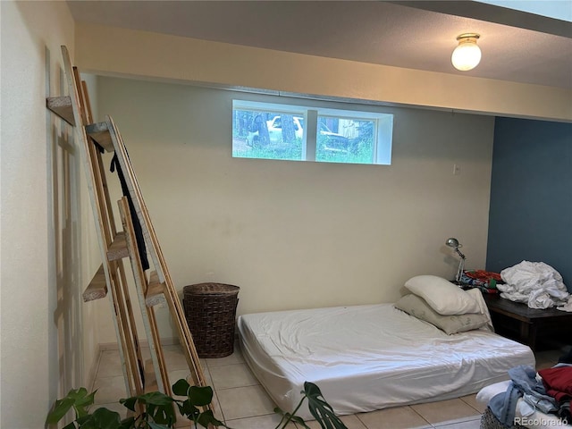 bedroom with light tile patterned flooring