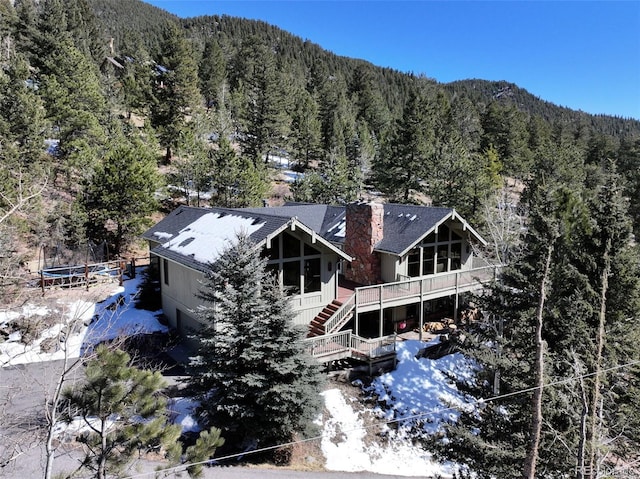 birds eye view of property with a forest view