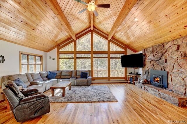 living room featuring baseboard heating, a ceiling fan, wood ceiling, wood finished floors, and beamed ceiling