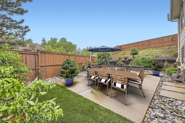 12668 W 1st Pl Unit 81, Denver, CO 80228 - fenced backyard with outdoor dining area and a patio