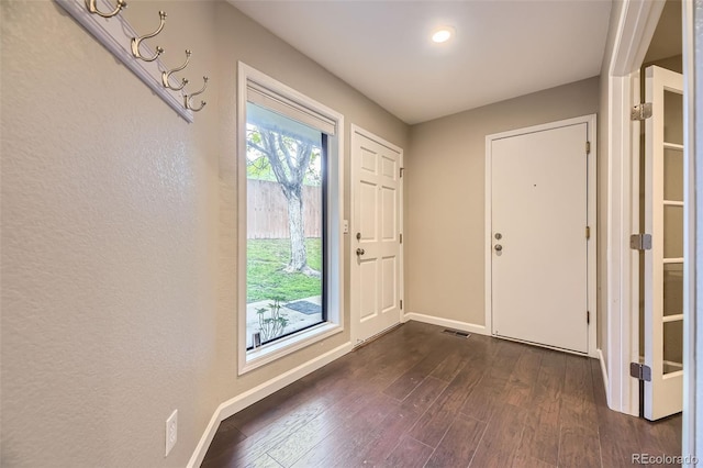 12668 W 1st Pl Unit 81, Denver, CO 80228 - entrance foyer with dark wood-style flooring and baseboards