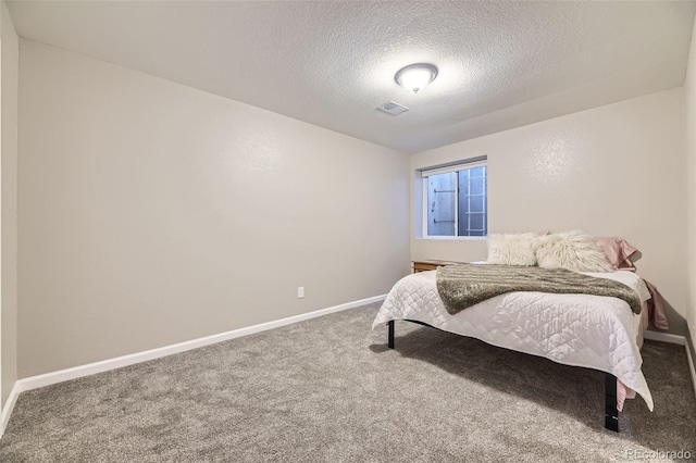 12668 W 1st Pl Unit 81, Denver, CO 80228 - carpeted bedroom featuring a textured ceiling and baseboards