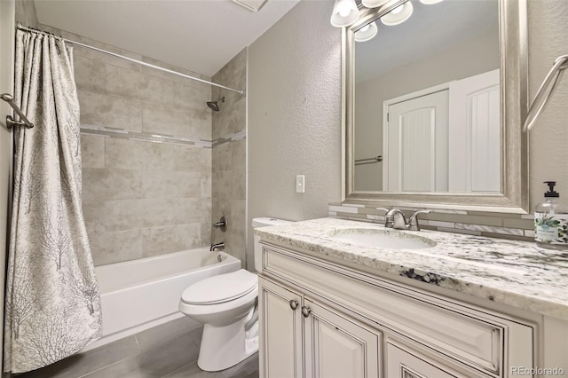 12668 W 1st Pl Unit 81, Denver, CO 80228 - full bath with vanity, shower / tub combo with curtain, toilet, a textured wall, and tile patterned flooring