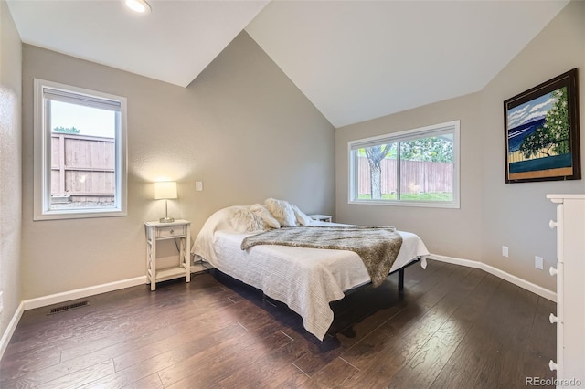 12668 W 1st Pl Unit 81, Denver, CO 80228 - bedroom with vaulted ceiling, baseboards, and dark wood-type flooring