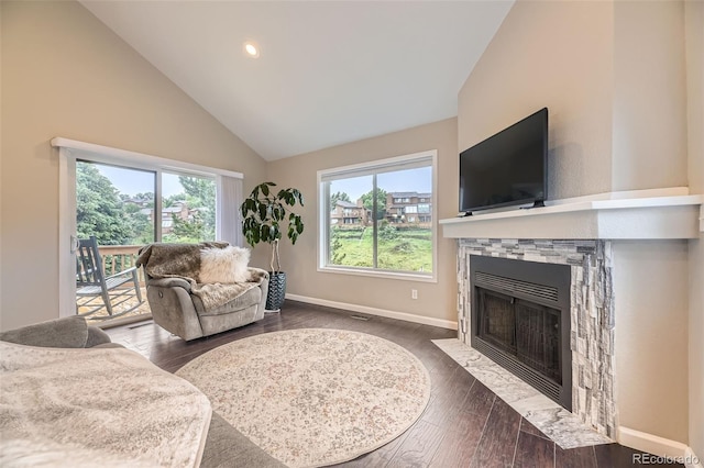 12668 W 1st Pl Unit 81, Denver, CO 80228 - living room with a fireplace with flush hearth, plenty of natural light, high vaulted ceiling, dark wood-style flooring, and recessed lighting