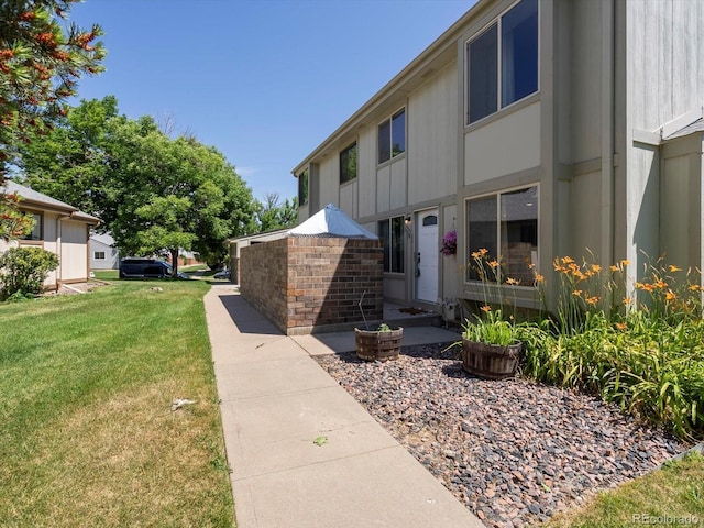 1714 W 102nd Ave, Thornton, CO 80260 - view of property exterior featuring a lawn