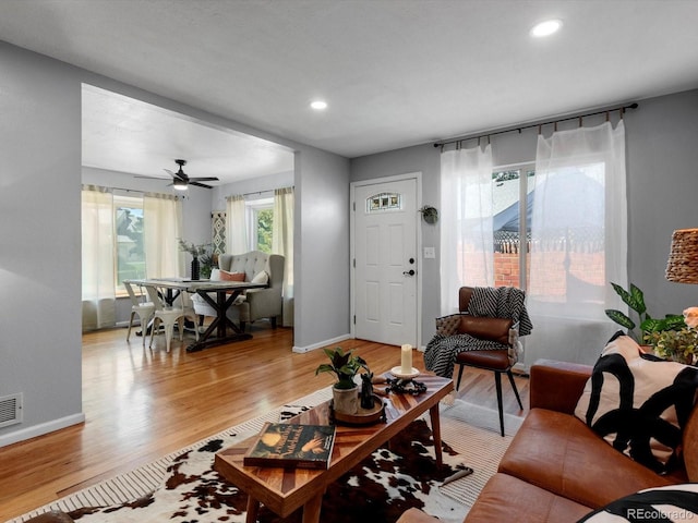 1714 W 102nd Ave, Thornton, CO 80260 - living room with light wood finished floors, recessed lighting, and a ceiling fan