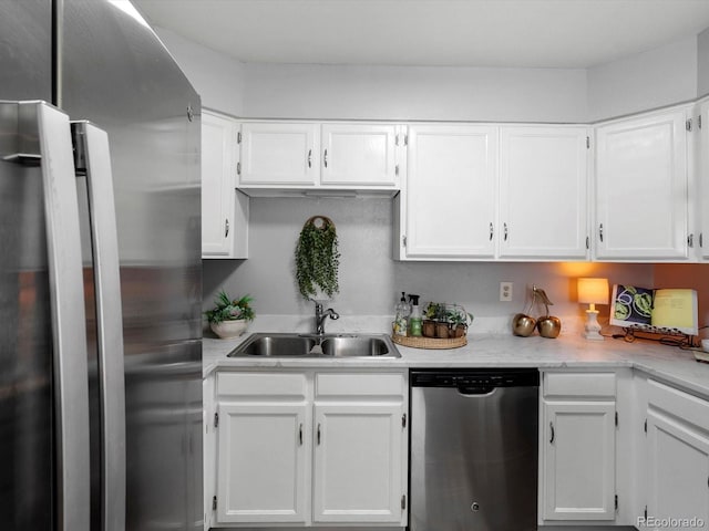 1714 W 102nd Ave, Thornton, CO 80260 - kitchen featuring appliances with stainless steel finishes, white cabinets, and light countertops