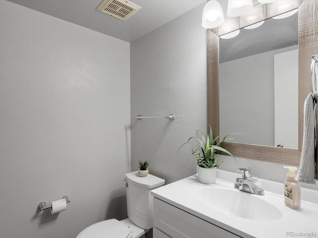 1714 W 102nd Ave, Thornton, CO 80260 - half bathroom featuring vanity and a textured wall