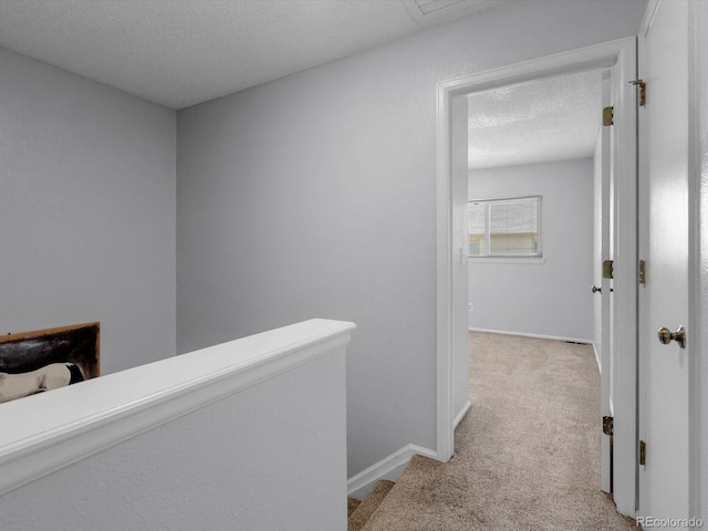 1714 W 102nd Ave, Thornton, CO 80260 - hallway with light carpet, an upstairs landing, and a textured ceiling