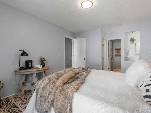 1714 W 102nd Ave, Thornton, CO 80260 - bedroom with a textured ceiling and baseboards