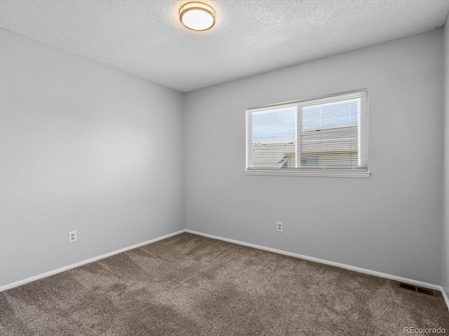 1714 W 102nd Ave, Thornton, CO 80260 - spare room with carpet flooring and a textured ceiling