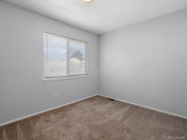1714 W 102nd Ave, Thornton, CO 80260 - carpeted spare room featuring a textured ceiling and baseboards