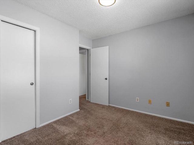 1714 W 102nd Ave, Thornton, CO 80260 - unfurnished bedroom featuring carpet flooring, a textured ceiling, and a closet