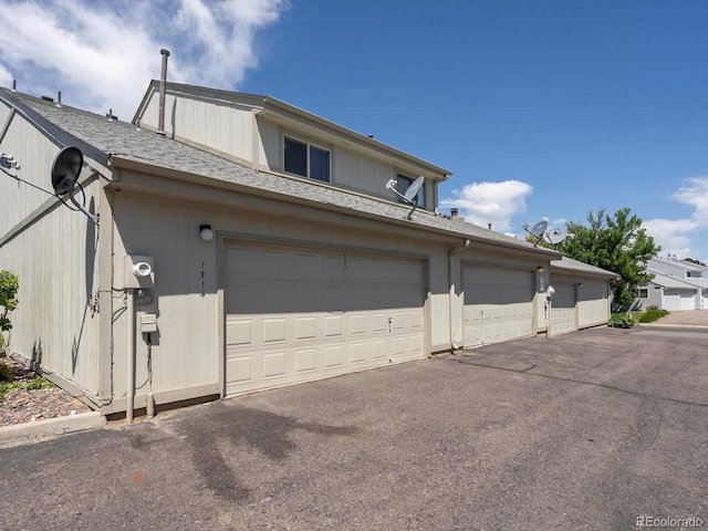 1714 W 102nd Ave, Thornton, CO 80260 - view of front of house with roof with shingles