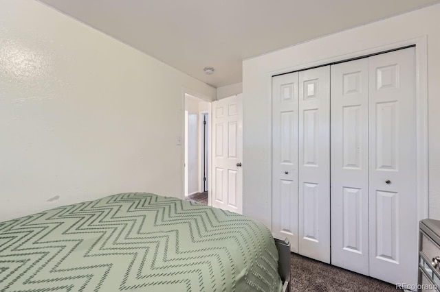 carpeted bedroom with a closet