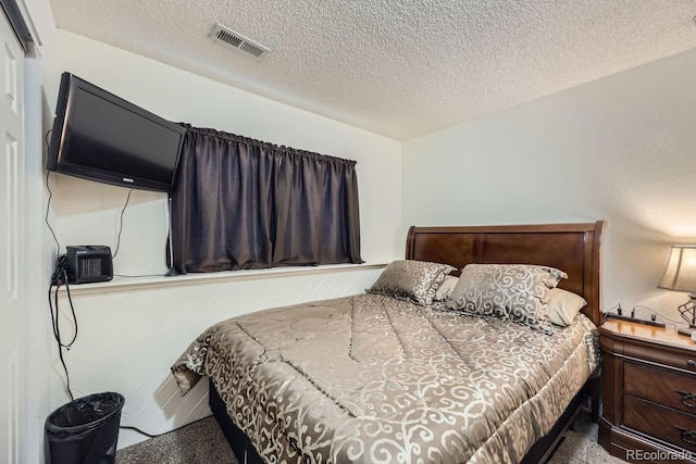 bedroom featuring a textured ceiling