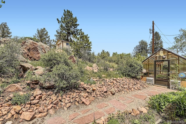 33799 Warren Rd, Pine, CO 80470 - view of yard featuring an exterior structure and an outbuilding