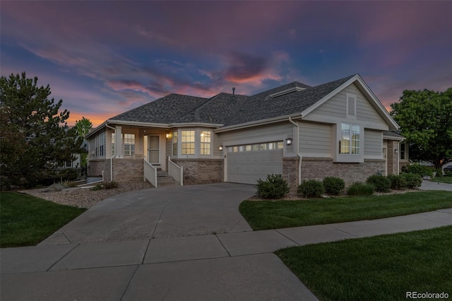 8258 S Sicily Ct, Aurora, CO 80016 - view of front facade with brick siding, a garage, concrete driveway, a front yard, and a shingled roof