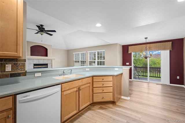 8258 S Sicily Ct, Aurora, CO 80016 - kitchen with white dishwasher, a sink, light wood finished floors, a chandelier, and plenty of natural light