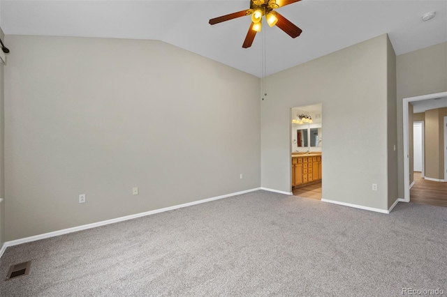 8258 S Sicily Ct, Aurora, CO 80016 - unfurnished bedroom with lofted ceiling, light colored carpet, baseboards, ensuite bath, and ceiling fan