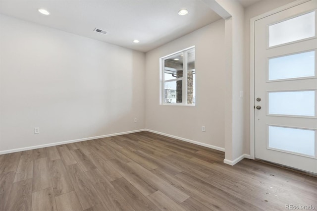 entryway with recessed lighting, wood finished floors, visible vents, and baseboards