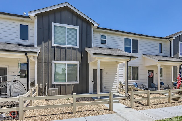 630 Apache Trl Unit D2, Ault, CO 80610 - multi unit property featuring board and batten siding, a fenced front yard, and covered porch