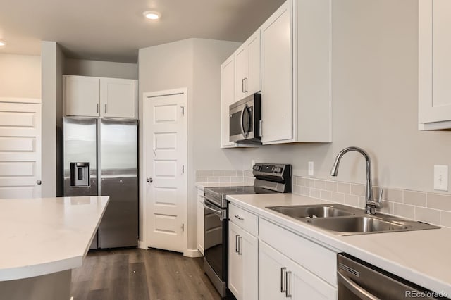 630 Apache Trl Unit D2, Ault, CO 80610 - kitchen with appliances with stainless steel finishes, dark wood-style floors, white cabinets, light countertops, and recessed lighting