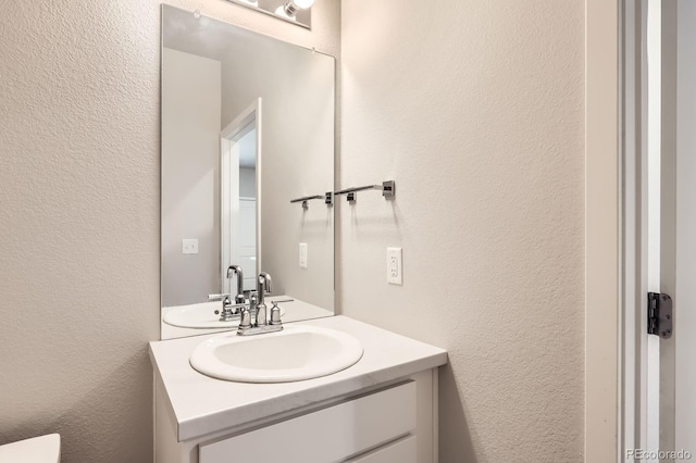 630 Apache Trl Unit D2, Ault, CO 80610 - bathroom featuring a textured wall and vanity