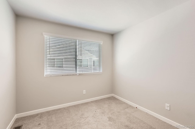 630 Apache Trl Unit D2, Ault, CO 80610 - empty room with plenty of natural light and light colored carpet
