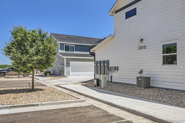 630 Apache Trl Unit D2, Ault, CO 80610 - view of side of home with an attached garage and concrete driveway