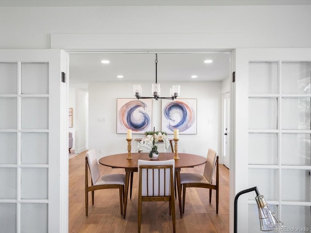 15229 Navajo St, Broomfield, CO 80023 - dining area with a chandelier, wood finished floors, and recessed lighting