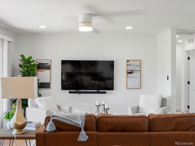 15229 Navajo St, Broomfield, CO 80023 - living area featuring a ceiling fan, wood finished floors, and recessed lighting