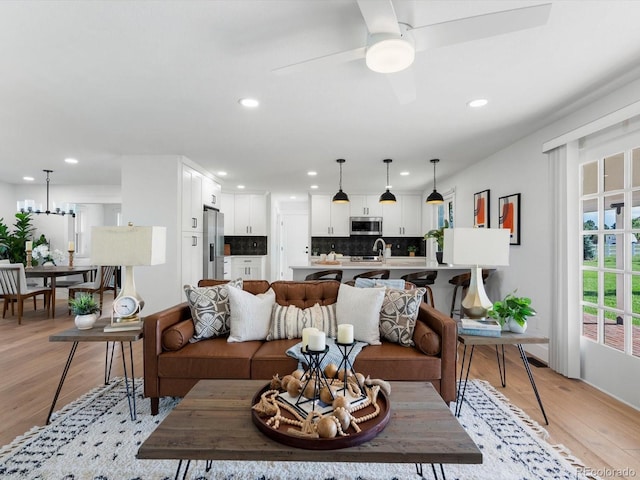 15229 Navajo St, Broomfield, CO 80023 - living area with light wood-style floors, recessed lighting, and a ceiling fan