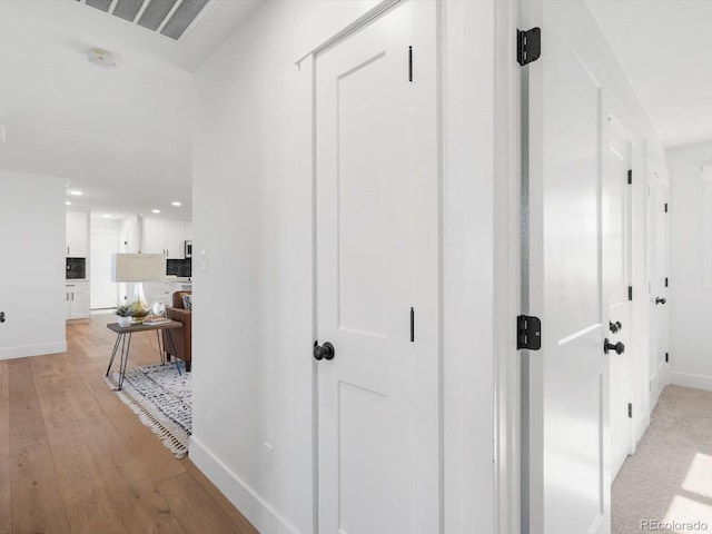 15229 Navajo St, Broomfield, CO 80023 - corridor with light wood finished floors and recessed lighting